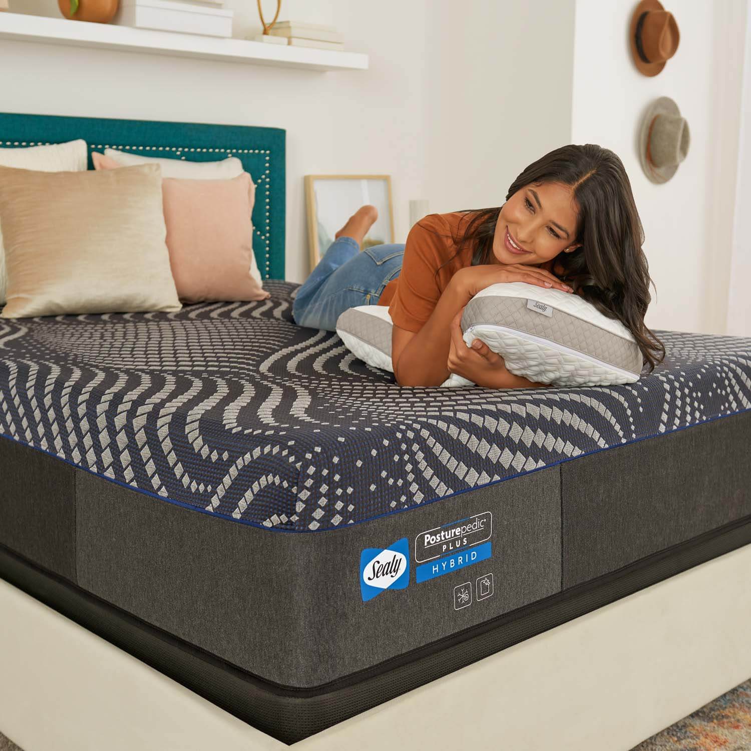 woman laying on Sealy Posturepedic Plus Albany Hybrid Medium Mattress